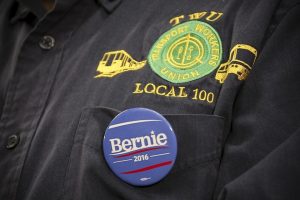 Photo of a union jacket with a Bernie Sanders campaign pin on it