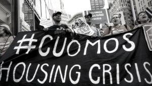 Photo of a banner that says #Cuomos Housing Crisis