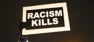 black background with large letters saying Racism Kills
