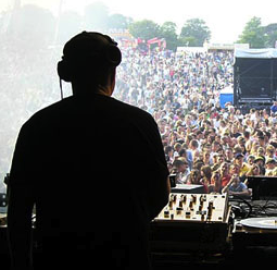 Photograph depicting the silhouette of a disc jockey