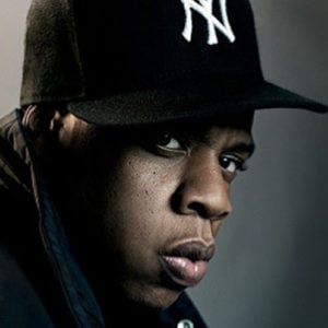 Photo of a black man (Jay Z) wearing a New York Yankees baseball cap