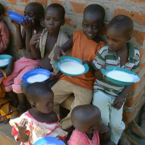 Group of young children who look hungry holding empty diner plates in their hands