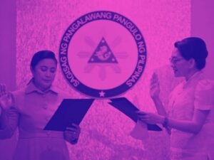 Outgoing Vice President Robredo swearing in democratic socialist Sen. Risa Hontiveros of Akbayan Party. The two stand in front of a plaque that reads “Sagisag Ng Pangalawang Pangulo Ng Pilipinas”