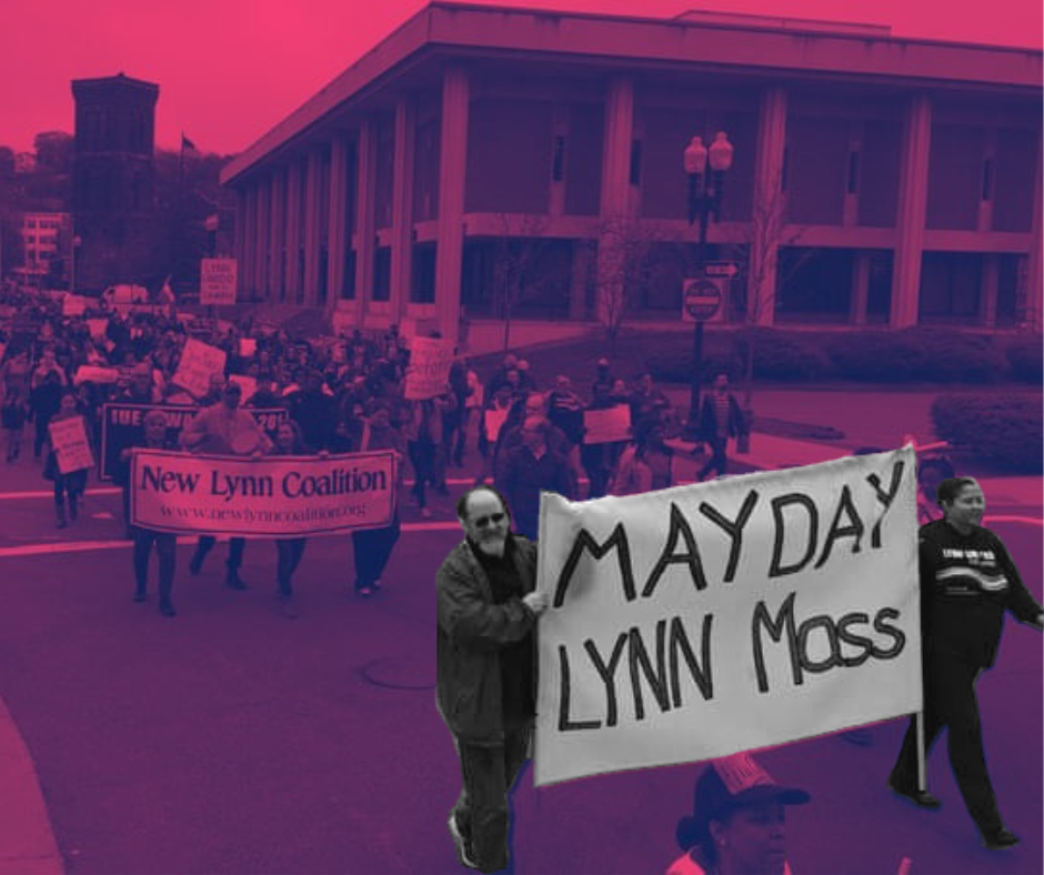 Small march with lead banner reading "May Day, Lynn Mass"